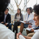 Mix of people talking in a meeting